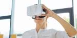 Woman smiling and holding her 3d glasses while being in a virtual reality.