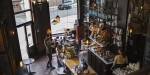 The interior of a café with high ceilings and tall windows. Photo: Benjamin A. Ward