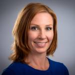 Portrettbilde av forsker Vilde Hernes som ser i kamera og smiler.