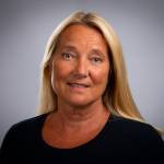 a portrait of Trine Myrvold who is looking into the camera smiling