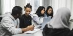 Master's students in International Social Welfare and Health Policy in a classroom.