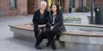 Researcher Berit Mortensen and Palestinian project leader Sahar Hassan on a bench on campus.