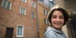 Adolescent girl outside house looking at camera. Photo: colourbox.com