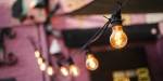 A string of lights hanging from a building. Photo: Benjamin A. Ward