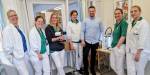 Gruppebilete av sju klinikarar og teknologar. Klinikarane har kvite klede på, og vi ser litt av det tekniske utstyret.