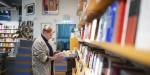 Olaug browsing for books at Tronsmo. Photo: Benjamin A. Ward.