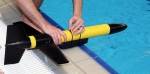 Underwater robot in black and yellow formed like a long tube with fins.