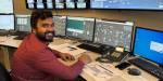 Tawfique is sitting in the VEAS control room. Many computer screens show technical measurements in the sewage plant. Tawfique smiles at us.