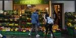 Two students shopping for vegetables downtown Oslo.