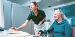 Employee at Sunnaas Hopital treats a patient using robotics.