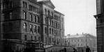 Black and white picture of an old brick building.