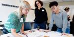 Participants working at something at one of the workshops.