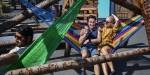 Austin and a friend in a colourful hammock.