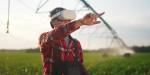 Farmer in a field wearing VR glasses
