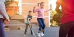 Children jumping rope in an urban environment.