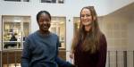 A portrait of two master's students smiling at the camera.