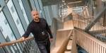 Rob Starling standing in the stairs of a tall building.