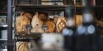 Fresh bread on a shelf at a bakery.