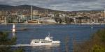 A boat in the Oslo Fjord, with the the Astrup Fearnley Museum visible in the background.